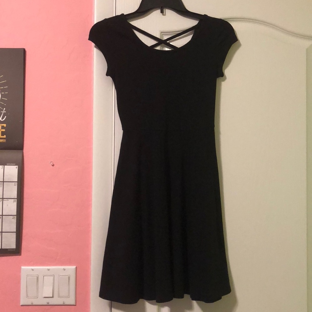 A black criss-cross back dress